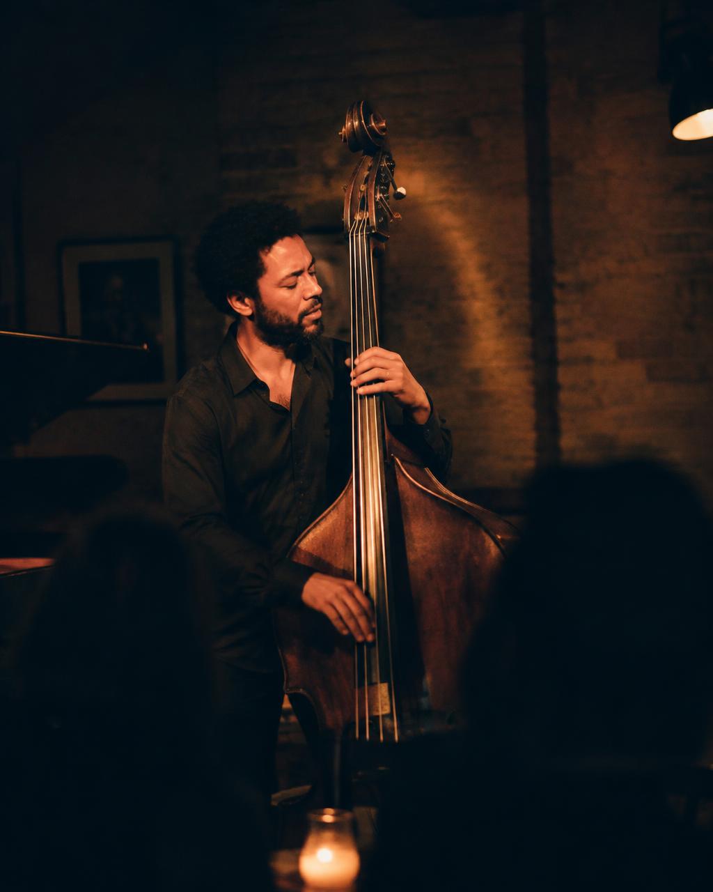 A double bassist performing in an intimate venue
